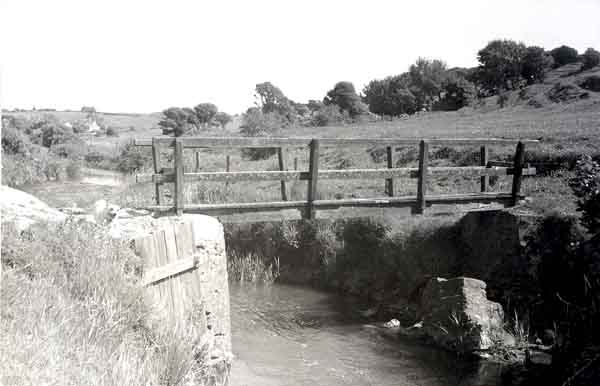 Old wooden bridge over the River Bride at Freshwater