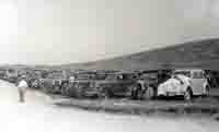 A collection of old cars parked by new Beach Road C1935