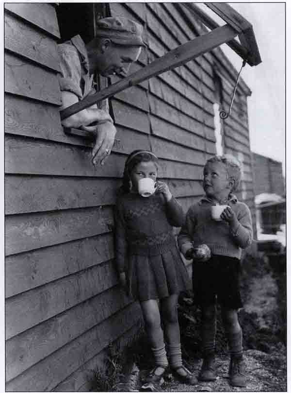 Boy & girl having drink with GI