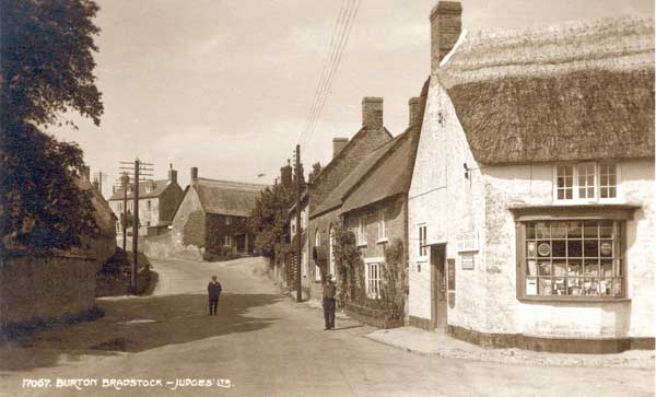 Two men in the road by the Post Office