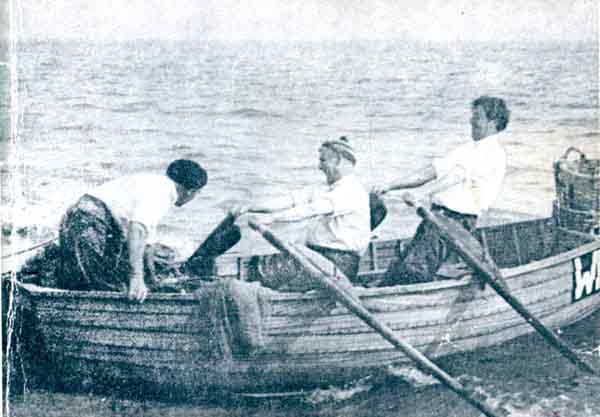 Rowing hard to haul the Seine net