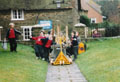 Mr. David Powell, Headteacheer of Burton Bradstock Primary School captures a photograph of both the historic bells and some of his pupils.